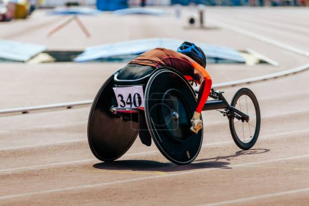 Photo for Female athlete in wheelchair racing track stadium in para athletics competition, summer sports games - Royalty Free Image