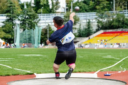 Photo for Male paraathlete shot put in T40 short stature, summer para athletics championships - Royalty Free Image