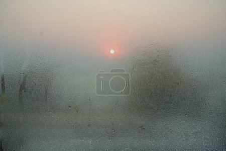 Téléchargez les photos : Double exposition, coucher de soleil et vapeur sur verre - en image libre de droit