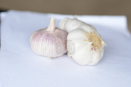Three heads of garlic piled together