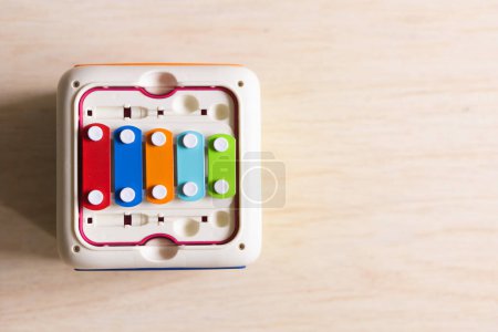Photo for Colorful xylophone box with flat lay wooden floor background - Royalty Free Image