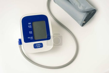 Photo for Automatic portable blood pressure machine with arm cuff isolated on white with copy space, studio shot. tonometer, hospital, research - Royalty Free Image