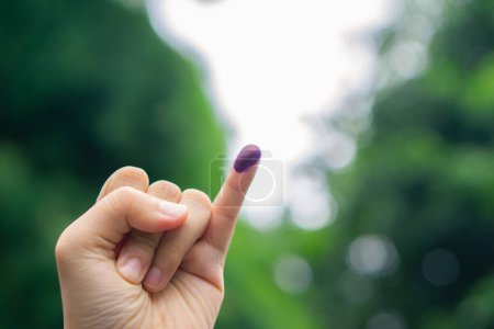 Purple ink on finger after presidential election in Indonesia