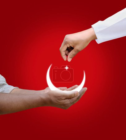 Photo for Side view of Muslim hands sharing food and money isolated on red background. - Royalty Free Image