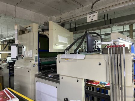 Photo for Dhaka, Bangladesh - 3rd march, 2023. Printing factory interior with modern offset printing machine and other machine.five color offset press lithography machine working - Royalty Free Image