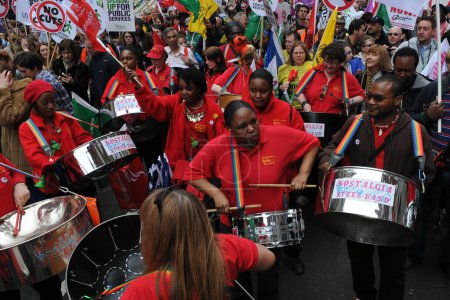 Photo for LONDON - MARCH 26, 2011: A steel band plays as protesters march against spending cuts to the public sector March 26 2011, in London, UK. An estimated 250,000 people attended the TUC organized rally. - Royalty Free Image