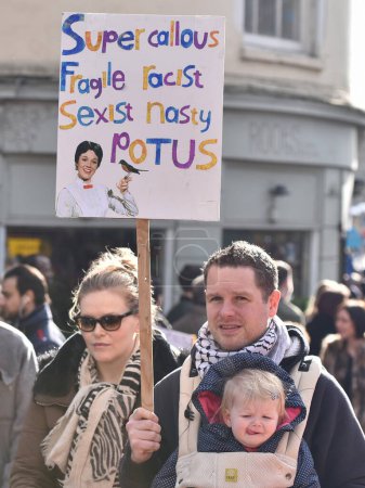Photo for Protesters hold up placards while rallying against Donald Trump and his upcoming state visit to Britain on February 4, 2017 in Bristol, UK. The US President is invited to visit the United Kingdom. - Royalty Free Image