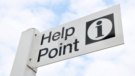 Photo for View of a generic information help point sign against a blue sky with white fluffy clouds - Royalty Free Image
