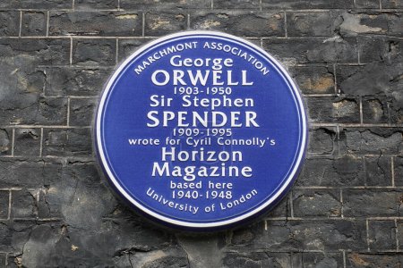 Photo for A blue heritage plaque is seen on a house wall commemorating a link between the building and novelists George Orwell and Sir Stephen Spender who lived at the address on August 1, 2023 in London, UK. - Royalty Free Image