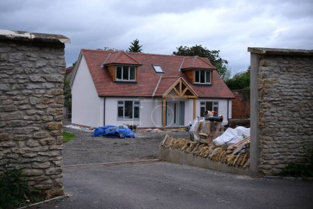 Photo for Exterior View of an Entrance and Courtyard of a Beautiful Cottage House Under Construction - Royalty Free Image