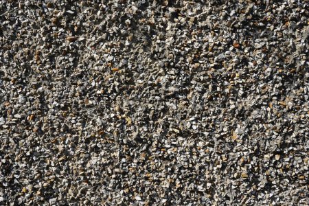 Close up view of a pebble dash wall