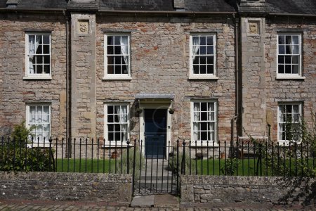 Photo for Exterior view of a beautiful stone house on a street in an English town - Royalty Free Image
