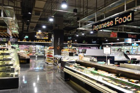 Photo for An aisle and Japanese food counter are seen in a Tops supermarket on February 14, 20 in Bangkok, Thailand. Tops is the largest supermarket chain in Thailand operating around 120 stores nationwide. - Royalty Free Image