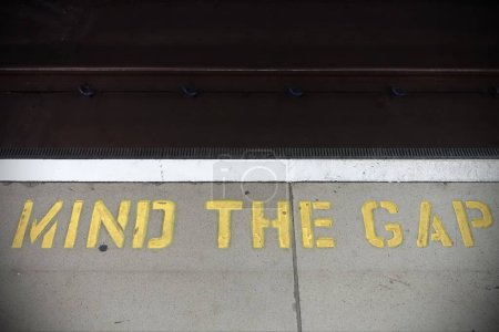 Photo for Sign on the platform, lettering "mind the gap" - Royalty Free Image