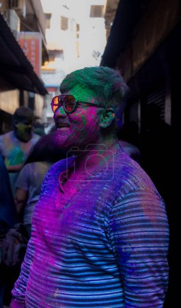 Photo for Chennai, Tamilnadu India - March 08 2023 : colorful street Holi celebration by large number of local people in Mint street, Holi festival portrait or Color splash Holi celebration - Royalty Free Image
