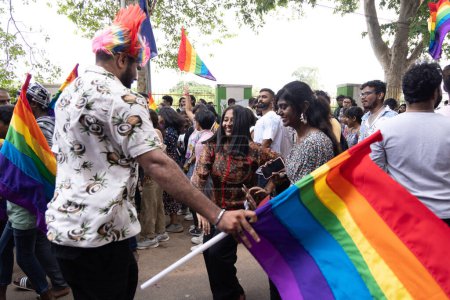 Photo for Chennai, Tamilnadu India - June 25 2023 : Rear view of Group of people with pride rainbow flag and banners in the pride parade. - Royalty Free Image