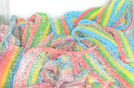 A closeup shot of an assortment of colorful sour candy.