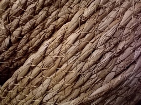 Photo for A macro shot for a handmade straw basket showcasing it's beautiful textures. - Royalty Free Image