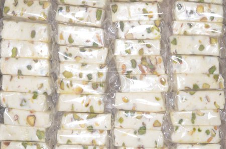 Photo for A white nougat with Pistachio, a very popular middle eastern sweets. - Royalty Free Image