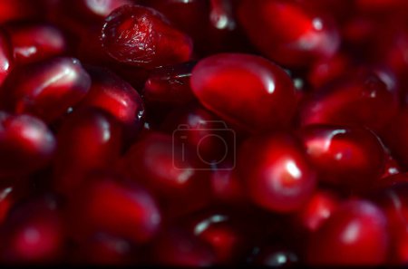 A macro shot of Pomegranate seeds with a special macro lens and flash.