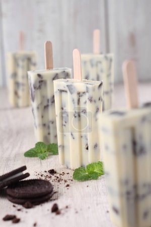 Photo for Ice cream with mint and chocolate on a wooden background. - Royalty Free Image