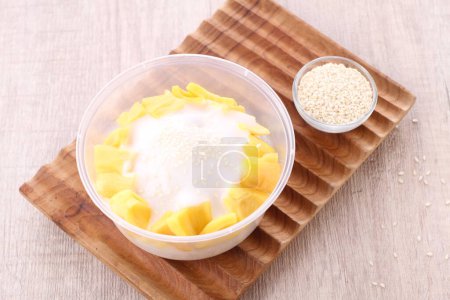 Photo for Takjil is a general term for snacks that are eaten shortly after breaking the fast, usually in the form of sweet foods such as banana compote, fruit soup, mixed ice, and so on. - Royalty Free Image
