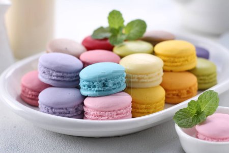 Photo for Colorful macaroons on a white plate - Royalty Free Image