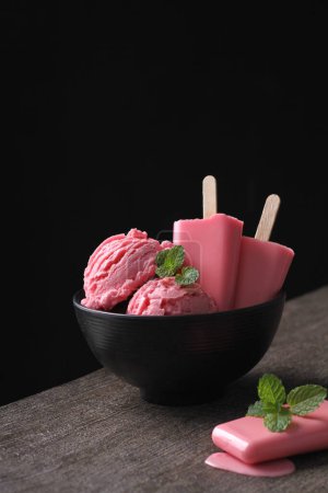 Photo for Strawberry flavored ice cream with black background - Royalty Free Image