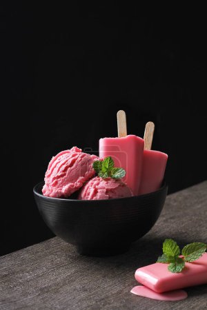 Photo for Strawberry flavored ice cream with black background - Royalty Free Image