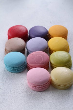 Photo for A macaron or French macaroon is a sweet meringue-based confection made with egg white, icing sugar, granulated sugar, almond meal, and food colouring. - Royalty Free Image
