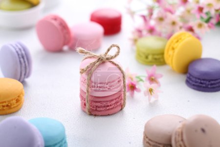 Photo for A macaron or French macaroon is a sweet meringue-based confection made with egg white, icing sugar, granulated sugar, almond meal, and food colouring. - Royalty Free Image