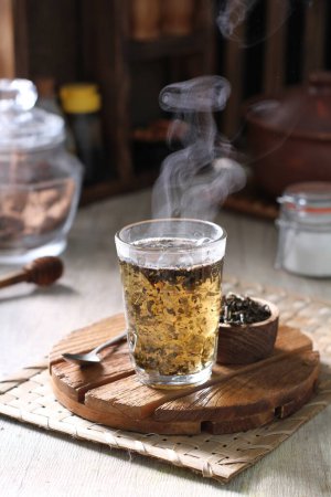 Photo for Hot telang flower tea in a clear glass - Royalty Free Image