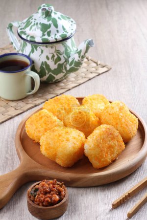 Photo for Fried chicken nuggets with sesame seeds and cheese - Royalty Free Image