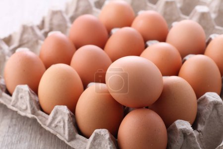 Photo for Raw chicken eggs in a bright background - Royalty Free Image