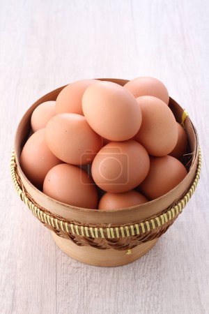 Photo for Raw chicken eggs in a bright background - Royalty Free Image