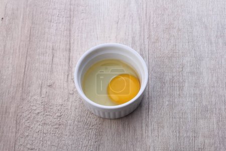 Photo for Bowl of tasty homemade mayonnaise sauce on wooden background - Royalty Free Image
