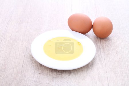 Photo for Egg yolk with a white background - Royalty Free Image