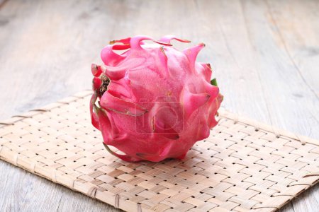 Photo for Dragon Fruit, also known as pitaya or pitahaya, is an exotic fruit grown from several different species of cactus indigenous to North, South, and Central America. - Royalty Free Image