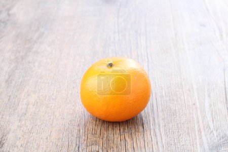 Photo for An orange is a fruit of various citrus species in the family Rutaceae, it primarily refers to Citrus  sinensis, which is also called sweet orange, to distinguish it from the related Citrus  aurantium, referred to as bitter orange. - Royalty Free Image