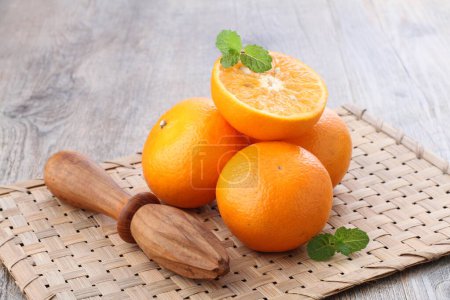 Photo for An orange is a fruit of various citrus species in the family Rutaceae, it primarily refers to Citrus  sinensis, which is also called sweet orange, to distinguish it from the related Citrus  aurantium, referred to as bitter orange. - Royalty Free Image