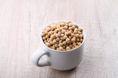 Photo for Soy beans in a bowl on a wooden background - Royalty Free Image