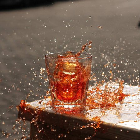 Photo for Glass of cola with ice cubes on a wooden table - Royalty Free Image