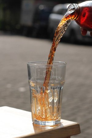 Photo for Pouring water into a glass cup - Royalty Free Image