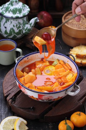 Foto de Asinan is a pickled vegetable or fruit dish, commonly found in Indonesia. Asin, Indonesian for "salty", is the process of preserving the ingredients by soaking them in a solution of salty water. Asinan is quite similar to rujak', - Imagen libre de derechos