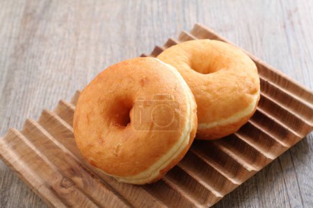 Téléchargez les photos : Donuts are fried confectionery, made from wheat flour batter, granulated sugar, egg yolks, baker's yeast, and butter. - en image libre de droit