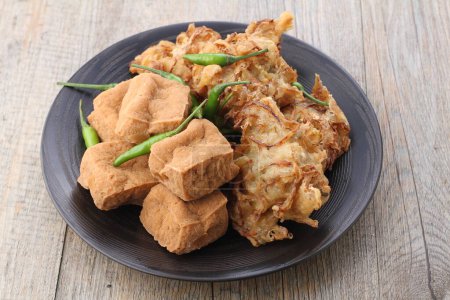 Photo for Gorengan is (almost) always on the top list in Indonesia. Gorengan refers to fried snacks made of various ingredients coated with flour batter. - Royalty Free Image