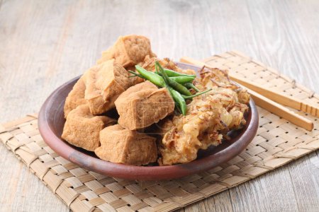 Photo for Gorengan is (almost) always on the top list in Indonesia. Gorengan refers to fried snacks made of various ingredients coated with flour batter. - Royalty Free Image