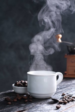 Photo for Coffee is a drink prepared from roasted coffee beans. Darkly colored, bitter, and slightly acidic, coffee has a stimulating effect on humans, primarily due to its caffeine content. It has the highest sales in the world market for hot drinks. - Royalty Free Image