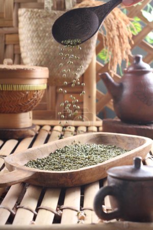 Photo for Green tea in a bowl on a wooden table - Royalty Free Image