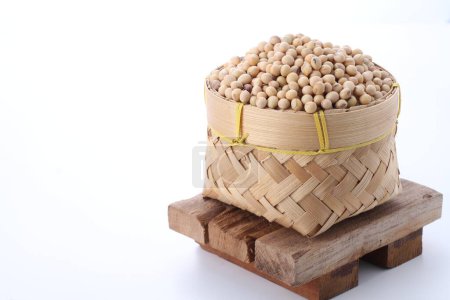 Photo for Raw soybean in a wooden bowl isolated on white background - Royalty Free Image